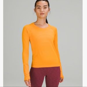 SWIFTLY TECH LONG SLEEVE SHIRT 2.0 *RACE LENGTH
Clementine/Clementine
Size: 8